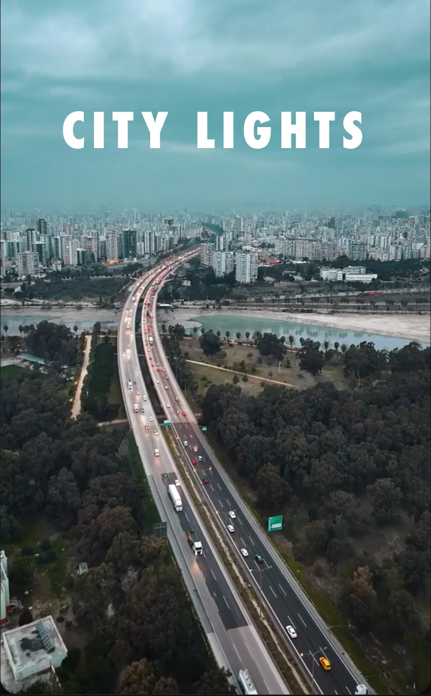 A bold spaced-out CITY LIGHTS title over an aerial city clip in the ExpoCut editor