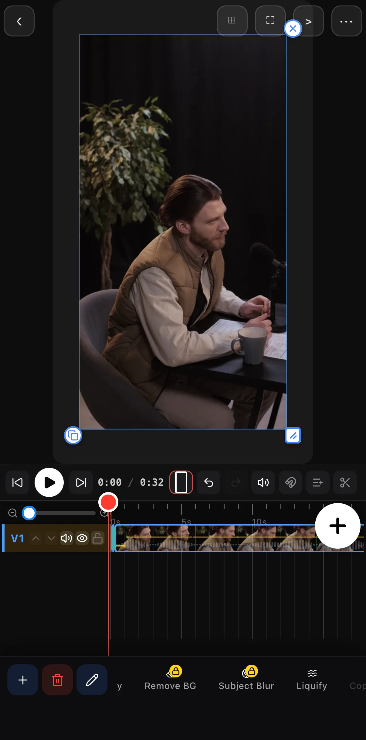 A 32-second podcast take on the timeline: a man at a microphone on the canvas and one long clip with a waveform on row V1.