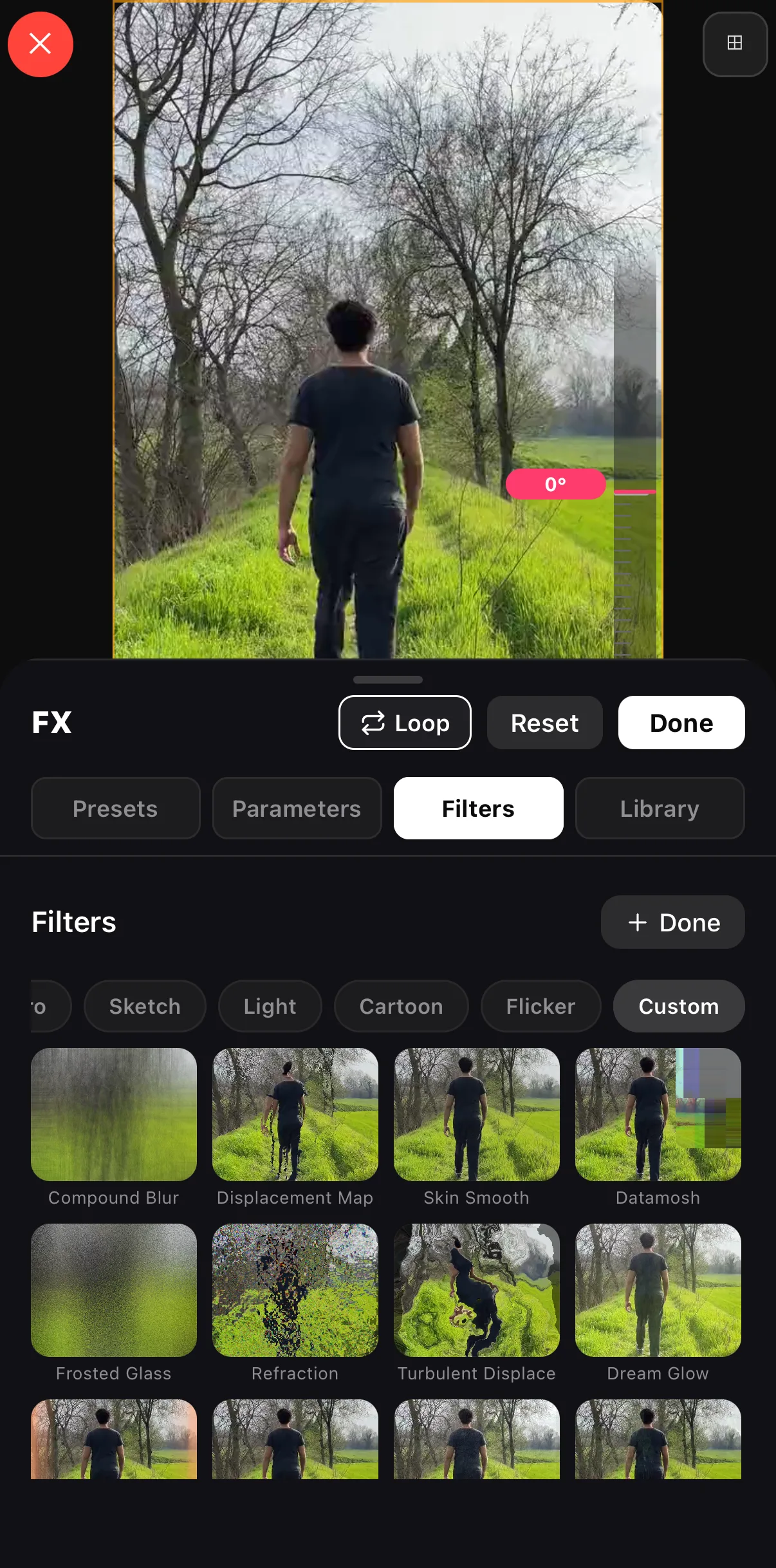 The FX sheet on the Filters tab with the catalog open on Custom: Compound Blur, Displacement Map, Skin Smooth, Datamosh, Frosted Glass, Refraction, Turbulent Displace and Dream Glow tiles rendered on the clip