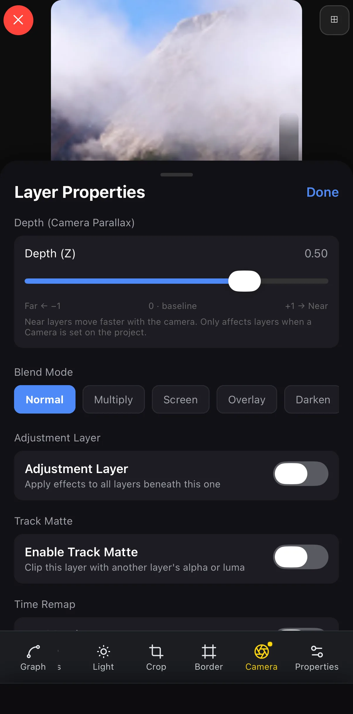 Layer Properties for the mountain photo: Depth (Z) slider at 0.50 on a Far −1 … 0 baseline … +1 Near scale, with the note that near layers move faster with the camera; the toolbar below shows the Camera button lit.