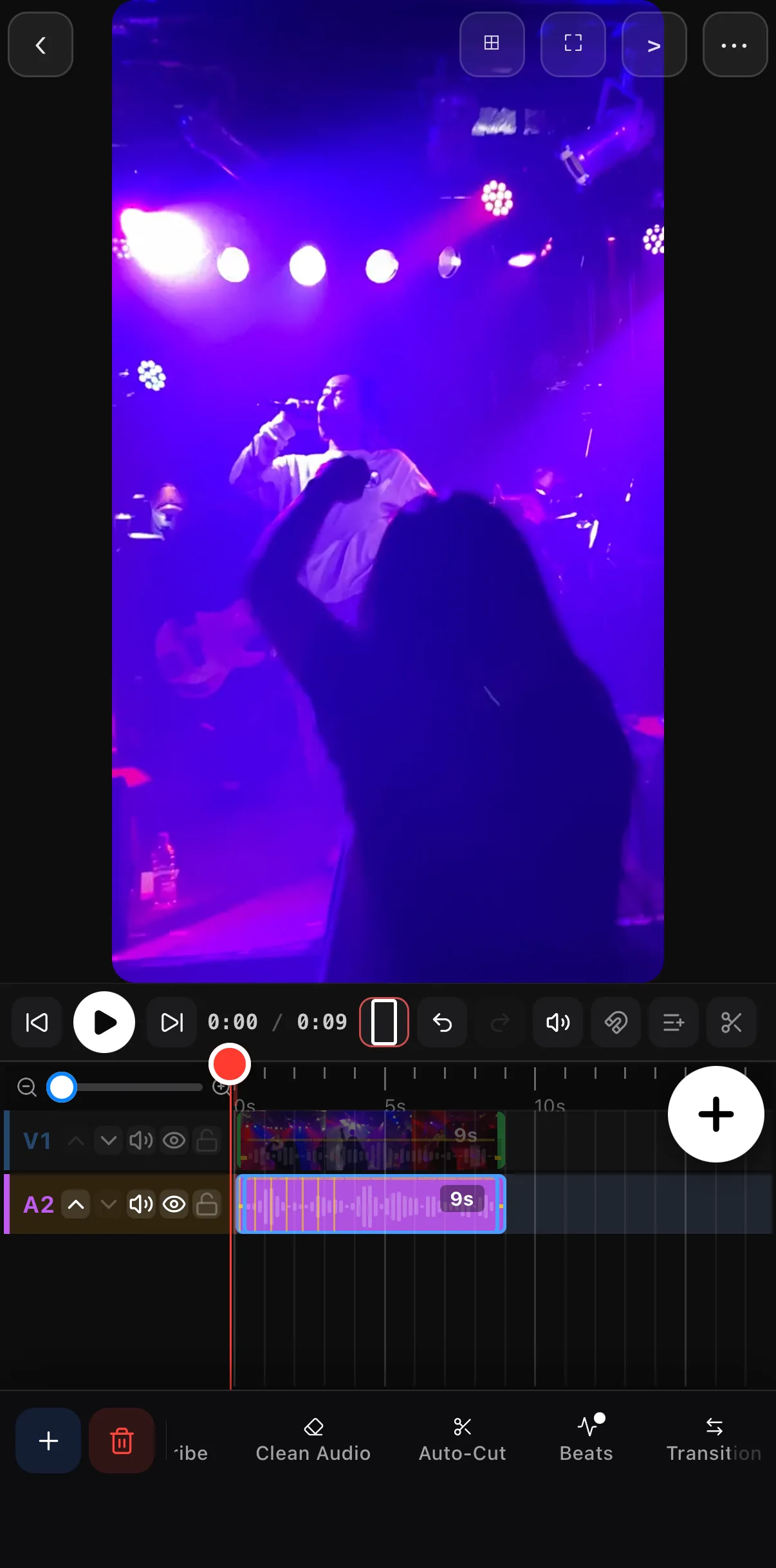 The timeline with a concert clip on V1 and the music on A2, the waveform now carrying yellow beat ticks