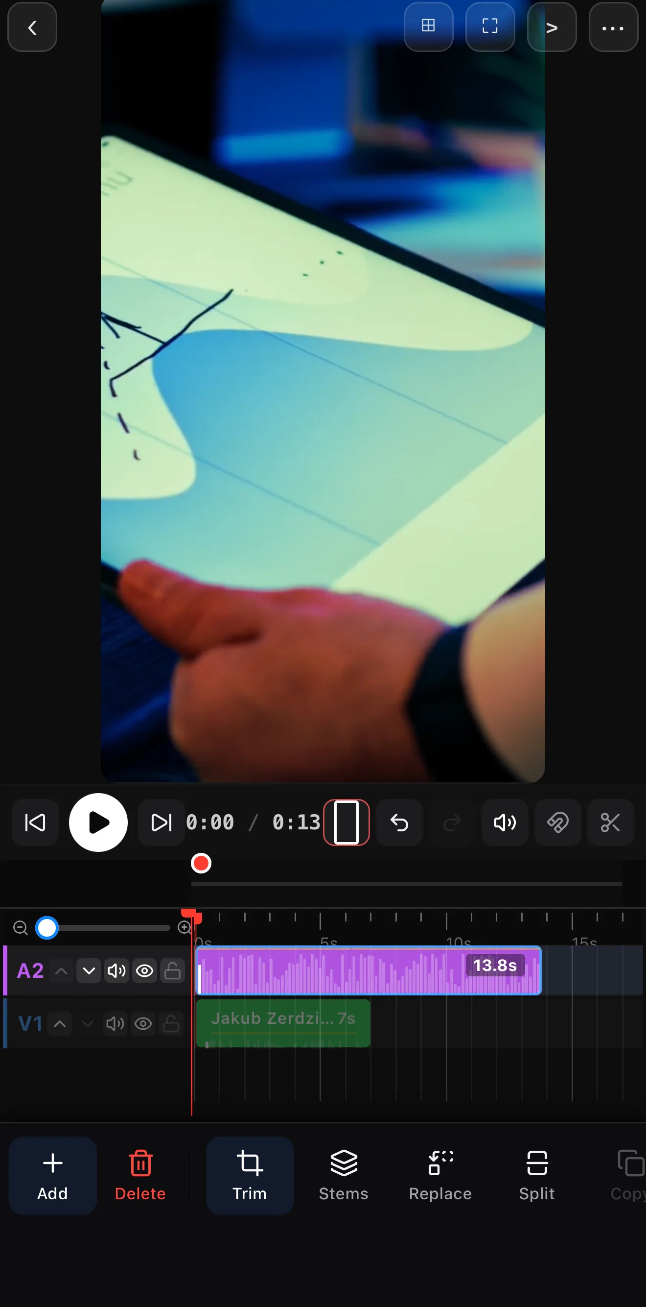 Editor timeline with the music waveform above the video clip and the clip toolbar showing a Split button.