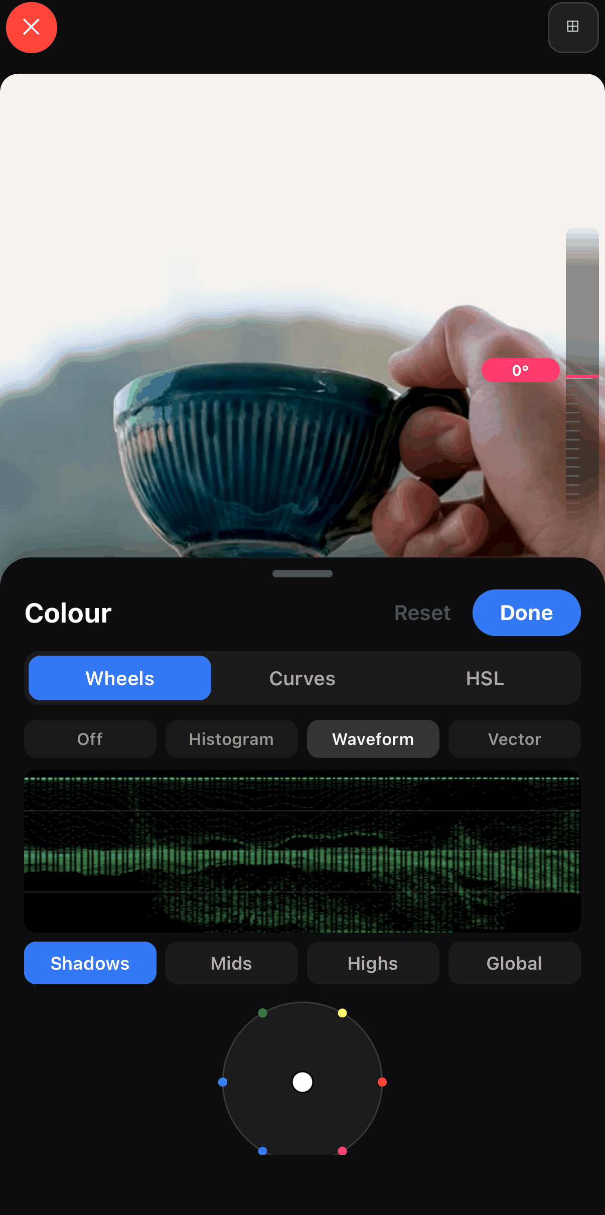 The Colour panel in ExpoCut with Wheels, Curves and HSL tabs, scope buttons Off, Histogram, Waveform and Vector, a live green waveform display, and the Shadows colour wheel.