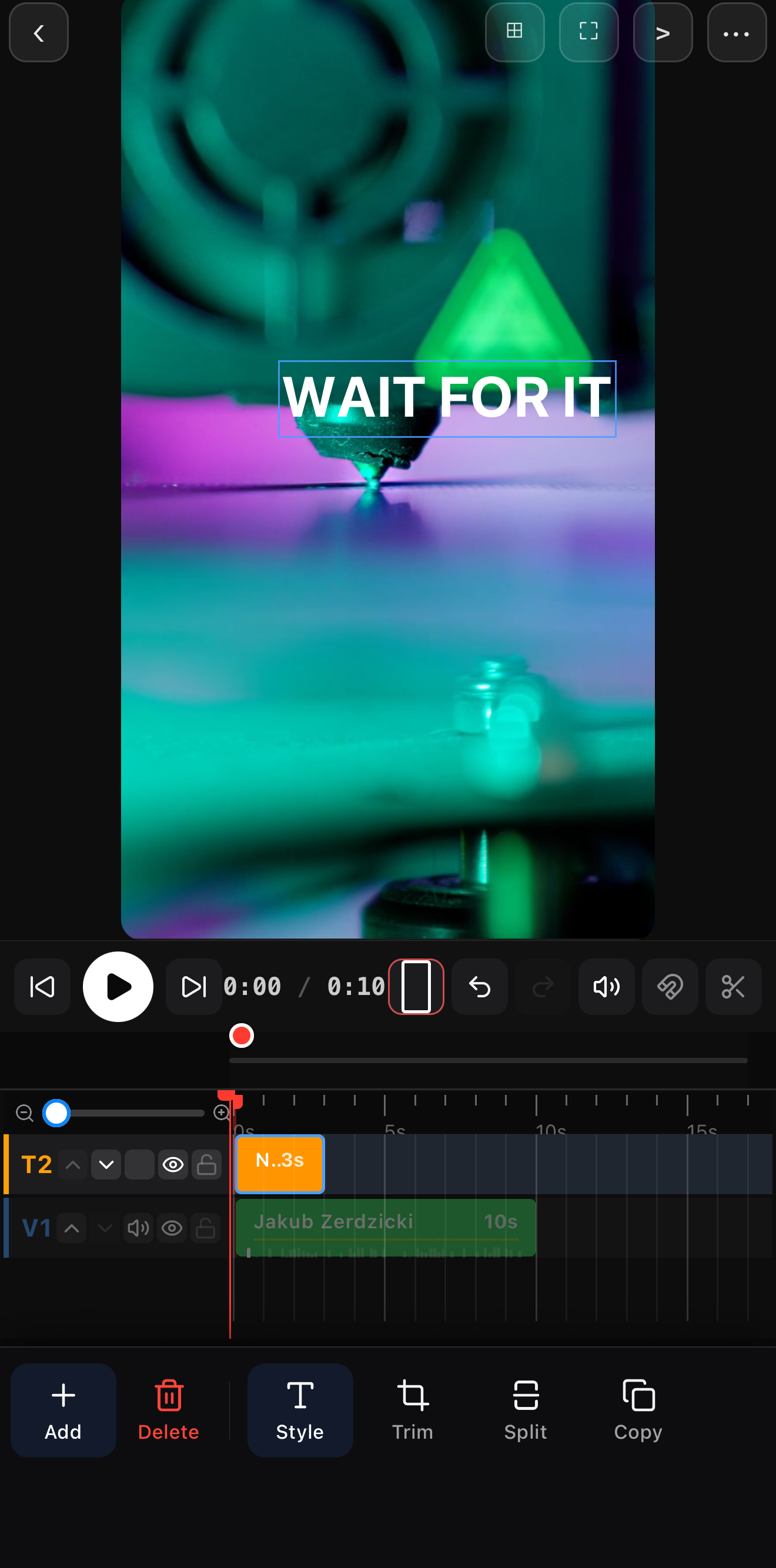 A bold WAIT FOR IT text hook centered over a colorful clip on the editor canvas