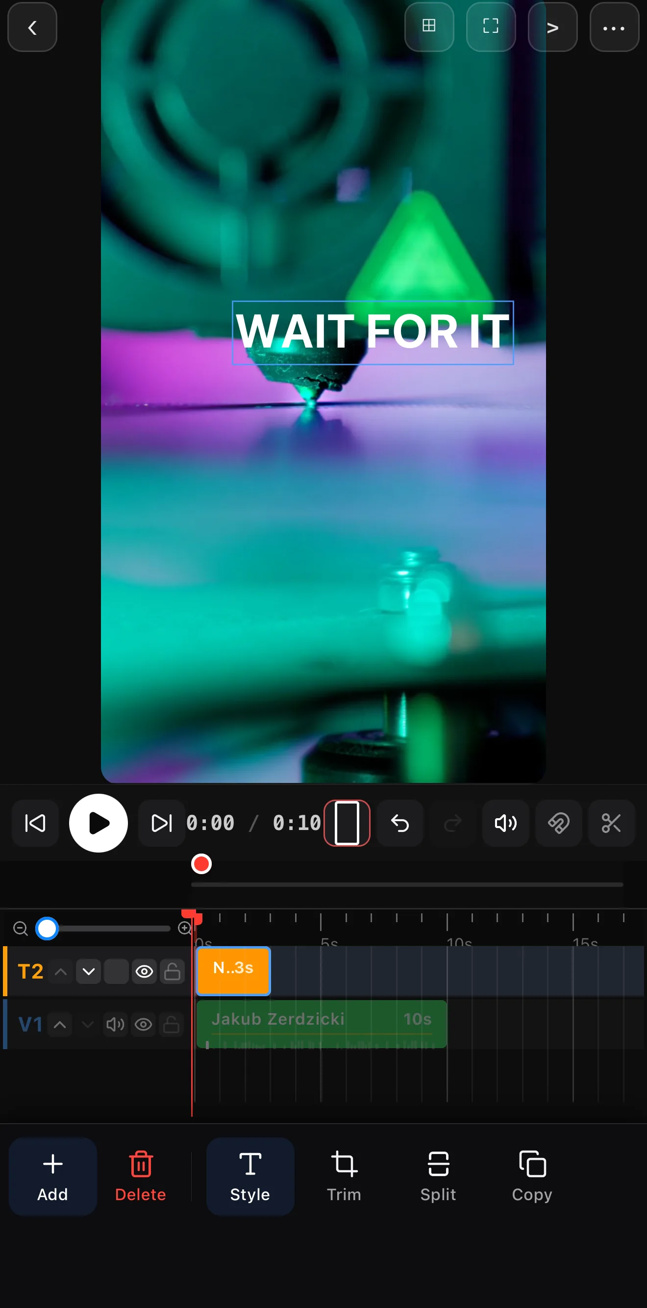 A bold WAIT FOR IT text hook centered over a colorful clip on the editor canvas