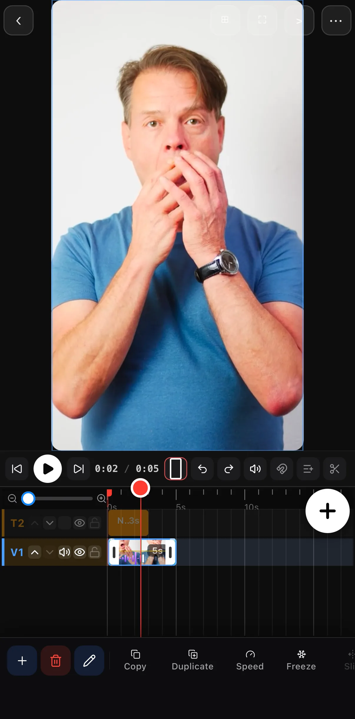 The video clip selected with the playhead at 0:02; the clip toolbar shows Copy, Duplicate, Speed, Freeze and Slip.