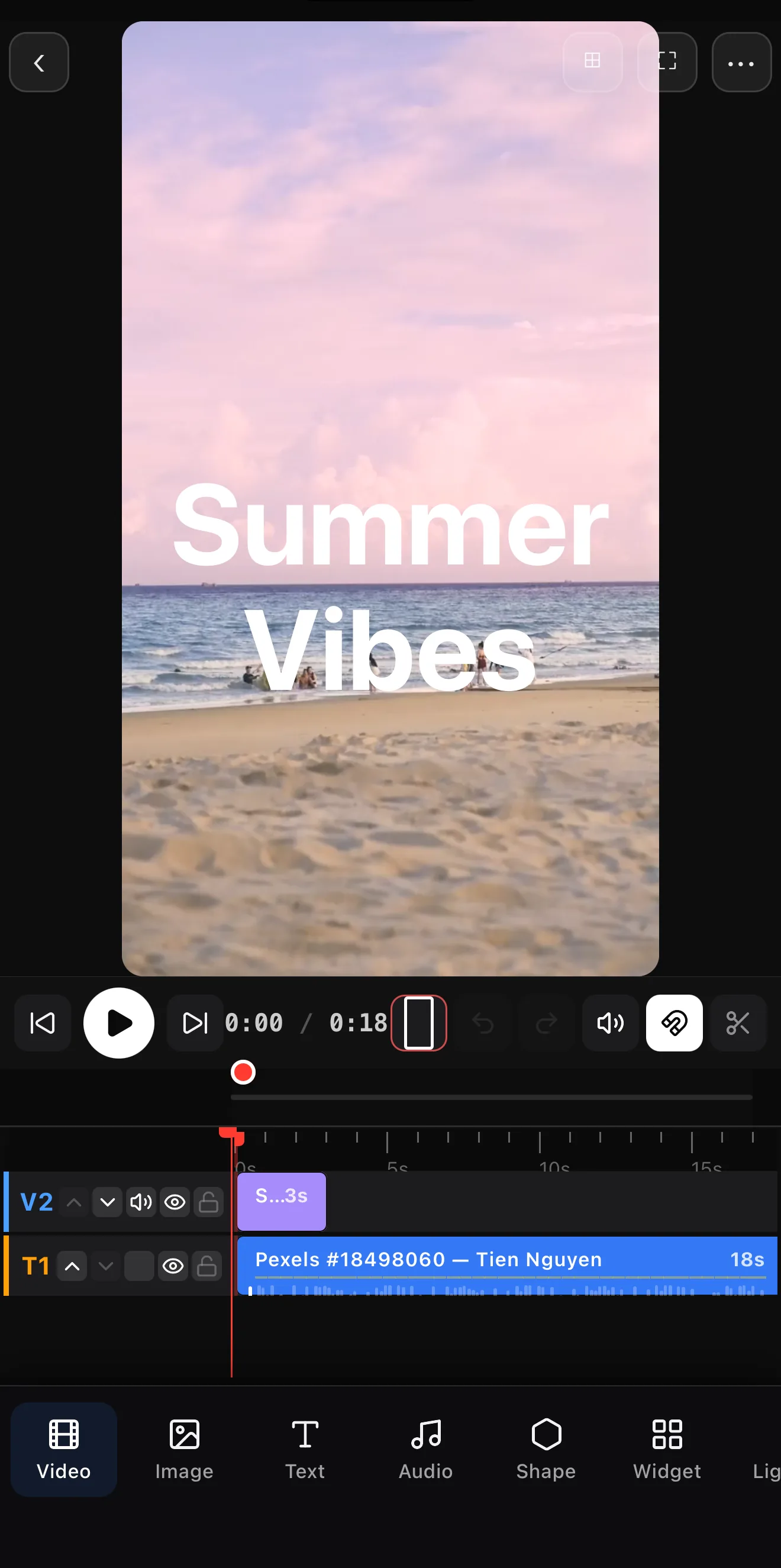 The timeline showing a text layer on track T2 above the video on V1