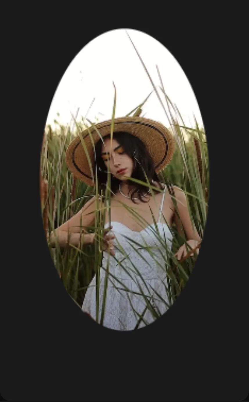 The result: the portrait clip clipped to a soft ellipse over black