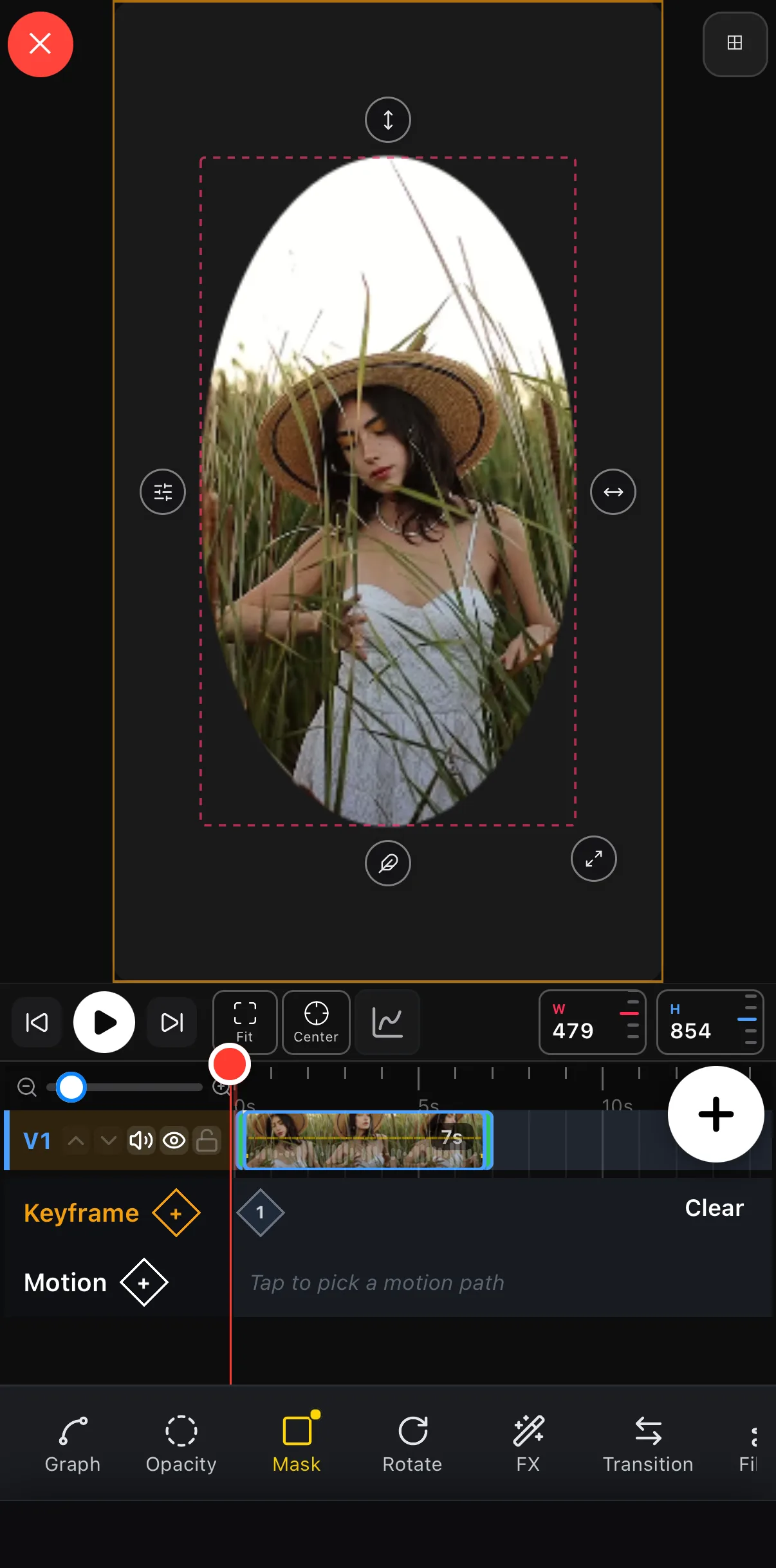 An ellipse mask on the clip with on-canvas handles: move (up/down and left/right), feather, resize and settings